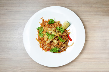  Thai style stir fried rice noodle on white plate.   