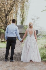 Fototapeta na wymiar Bride and groom from behind. 