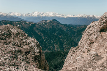Landscape of snow-capped peaks of the rocky mountains in Sunny weather. The concept of nature and travel.