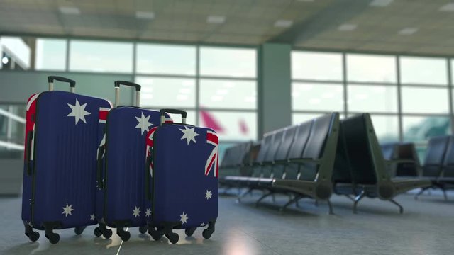Travel suitcases featuring flag of Australia. Australian tourism conceptual animation