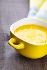 Cheese soup in a yellow plate