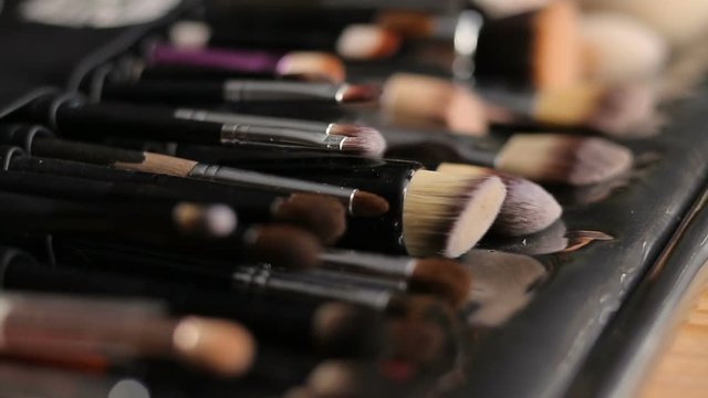 Set of professional make up brushes collection lie on table. Close up image. Beauty concept.