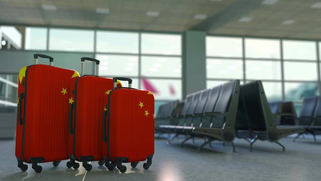 Travel suitcases featuring flag of China. Chinese tourism conceptual animation