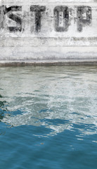 The word STOP painted on the wall