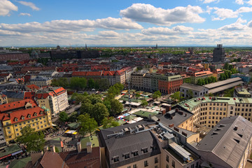 Fototapeta na wymiar Munich, Germany-APRIL 30, 2018: Aerial view to the ancient Viktualienmarkt is a daily food market and a square in the center of Munich. Bavaria