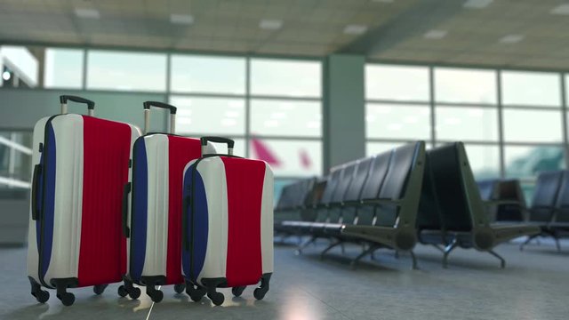 Travel suitcases featuring flag of Costa Rica. Tourism conceptual animation