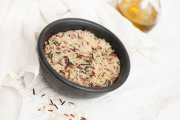 Fototapeta na wymiar mix rice in small black bowl on white background