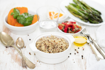 boiled quinoa and vegetables on white table