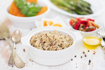 boiled quinoa and vegetables on white table