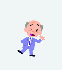 Old businessman doing the OK sign with his hand.