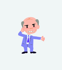 Old businessman, is angry and points his head with his index finger.