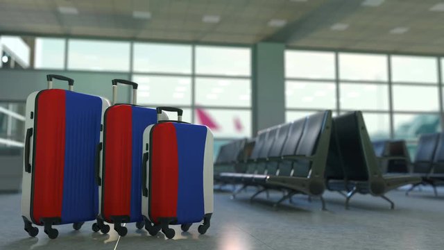 Travel suitcases featuring flag of Russia. Russian tourism conceptual animation