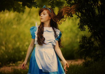 Alice in Wonderland.little girl in costume alice in wonderland