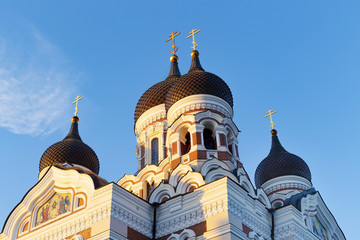 Fototapeta na wymiar Perspective view at top part of Alexander Nevsky Cathedral in Tallinn, Estonia. Orthodox church in Tallinn Old Town