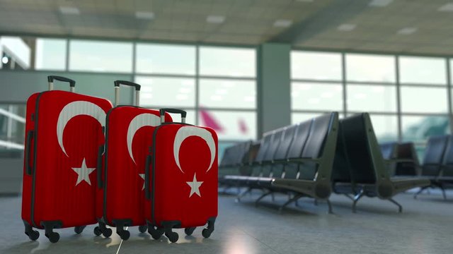 Travel suitcases featuring flag of Turkey. Turkish tourism conceptual animation