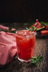 Refreshing summer watermelon juice in glasses with slices of watermelon