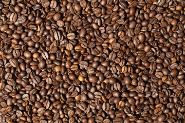 Geröstete, braune Kaffee-bohnen als Hintergrund oder Textur