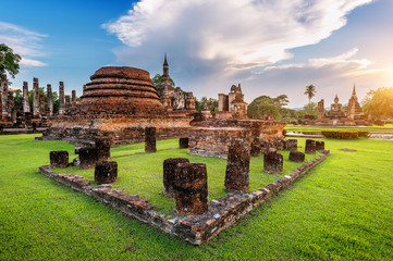 Buddha statue and Wat Mahathat Temple in the precinct of Sukhothai Historical Park, Wat Mahathat...