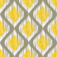 Yellow, white and grey rhomb seamless pattern in native ikat style.