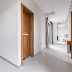 White apartment with wooden doors