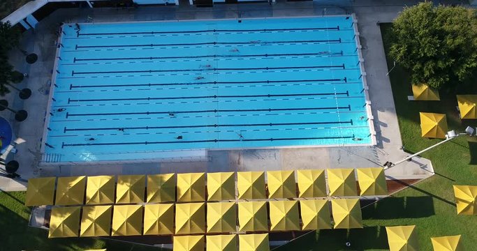 Swimming pool in public park of Sydney city CBD with recreational swimmers enjoying blue water and relaxing life style.
