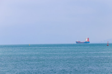 Cargo ship on the horizon at Black sea