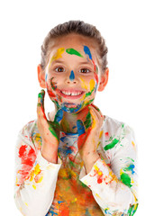 Funny girl with hands and face full of paint