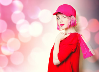 portrait of beautiful smiling young woman with shopping bag