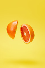 close up view of cut grapefruit isolated on yellow