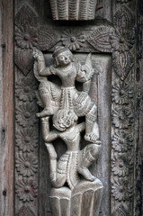Fototapeta na wymiar Ancient carved wooden figure at Shwe Nan Daw Kyaung, Myanmar