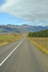 Fototapeta na wymiar Icelandic mountain stones and road and sky