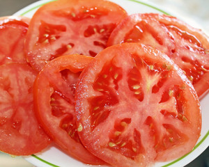 Slices of ripe fresh organic tomatoes

