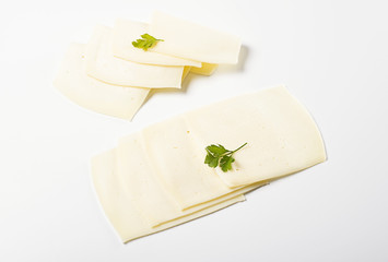 Slices of cheese on white background. Isolated.