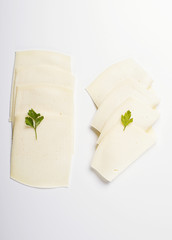 Slices of cheese on white background. Isolated.