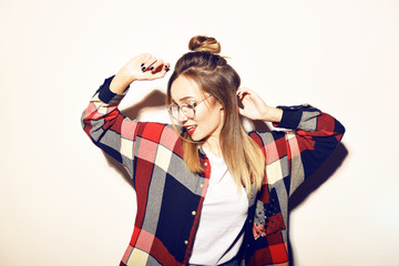 Fashion pretty young woman in glasses over white background. Lifestyle and people concept. Having...