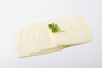 Slices of cheese on white background. Isolated.