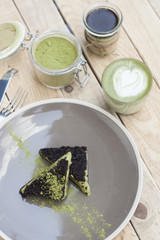 Cup of Matcha Green Tea and Cake and ice cream with green matcha