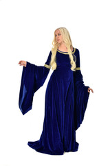 Fototapeta premium full length portrait of pretty blonde lady wearing a blue fantasy medieval gown. standing pose on white background.