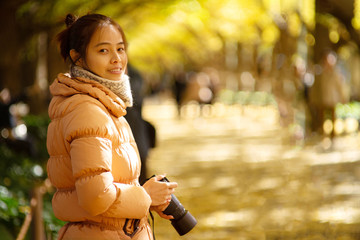  Autumn color at Jingu at Gaien Ginkgo Avenue a traveler girl sightseeing in there.