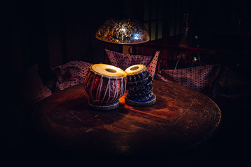 Naklejka premium ethnic musical instrument tabla in the interior of the chill-out