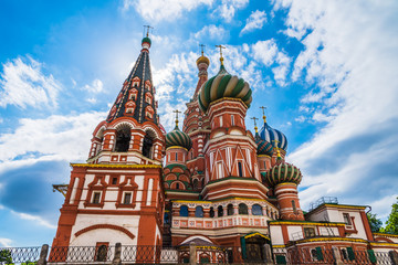 St. Basil's Cathedral on Red Square in Moscow against a blue sky with clouds