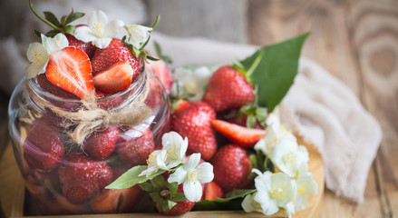 Fresh strawberries in jars
