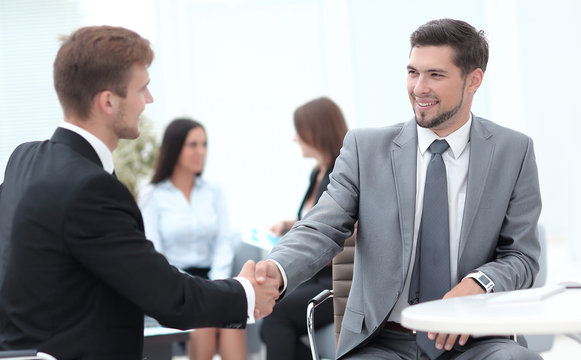 handshake Manager and the client in the office.