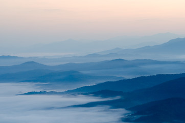 Sunset over mountains and fog