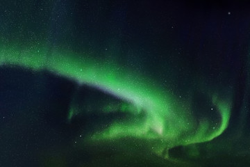 Night starry sky and Northern lights. Green aurora borealis