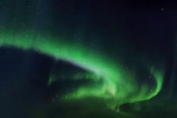 Fotobehang Night starry sky and Northern lights. Green aurora borealis © arvitalya