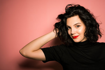 Young women on pink background