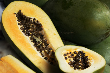 cut papaya fruit at market