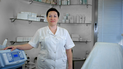Portrait of confident female doctor standing in lab coat, looking at camera