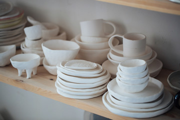 Handcrafted on a potter's wheel,Hands make clay from various items for home and sale in the store and at the exhibition, ceramic items are made in hand, the clay billet becomes a ceramic dish